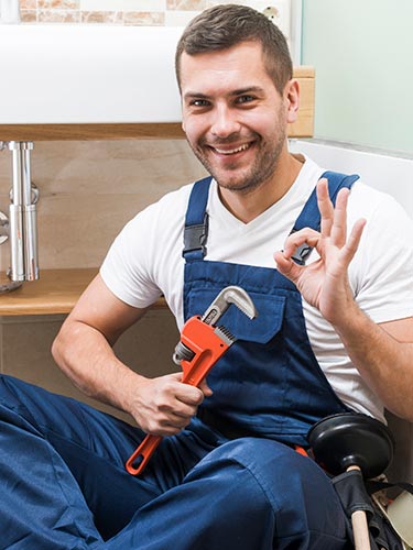 Happy plumber working